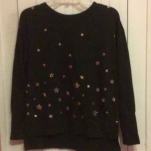 Black sweater with golden stars.